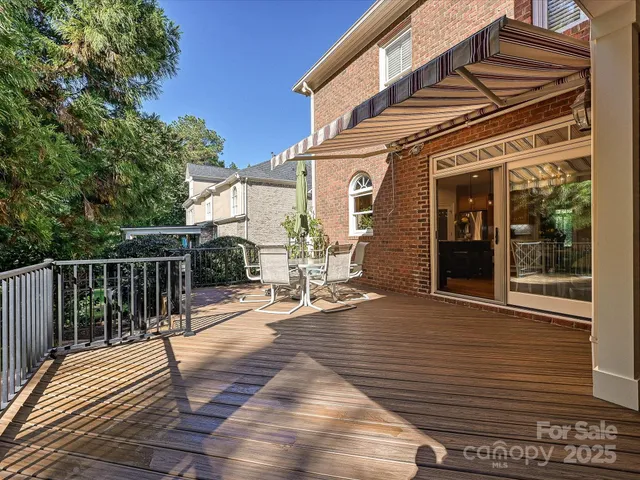 a view of a house with wooden floor and a large window