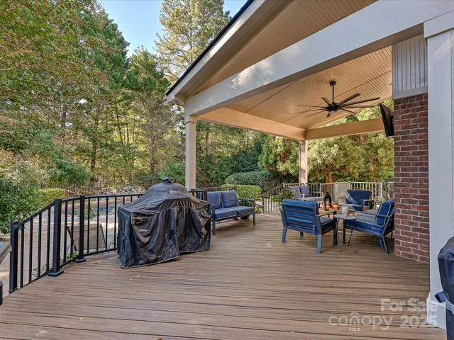 a view of a patio with a dining table and chairs