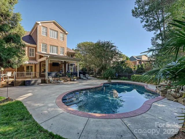 a view of a swimming pool with a patio