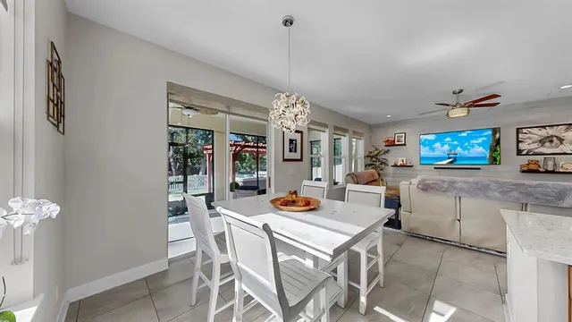 a living room with furniture and a large window with garden view