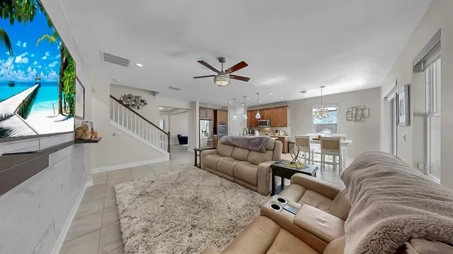 a spacious bathroom with a granite countertop double vanity sink a mirror and a shower