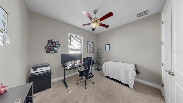 a bed sitting in a bedroom next to a window