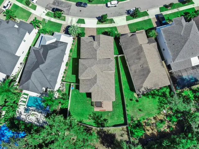 a view of a patio with couches and table and chairs and potted plants