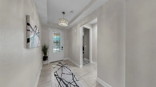 a living room with furniture and a mirror