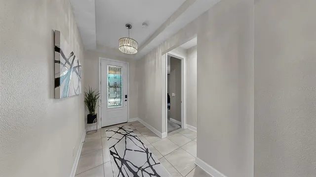 a living room with furniture and a mirror