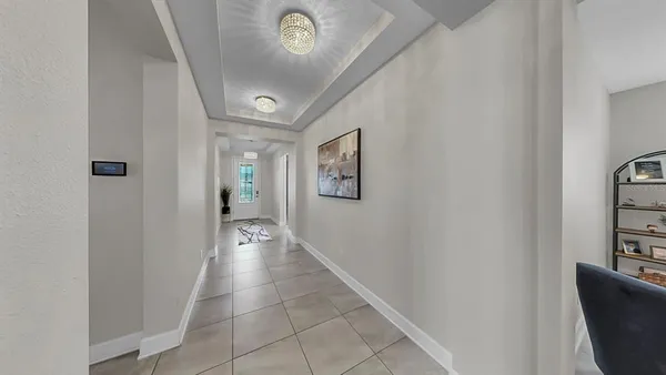 a kitchen with stainless steel appliances kitchen island granite countertop a refrigerator and a stove top oven