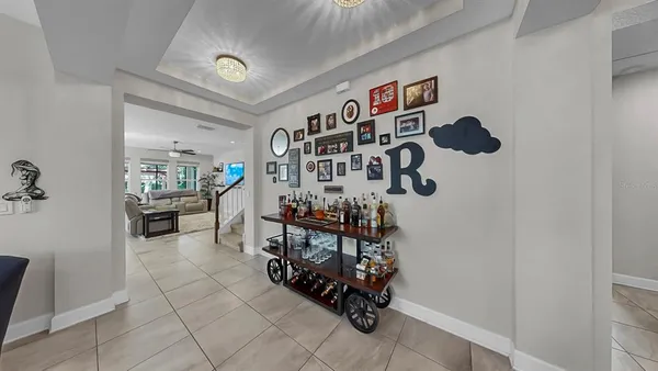 a kitchen with stainless steel appliances granite countertop a sink and a refrigerator
