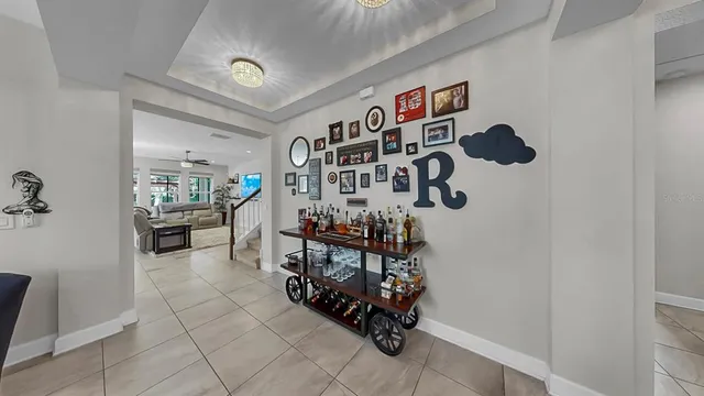 a kitchen with stainless steel appliances granite countertop a sink and a refrigerator