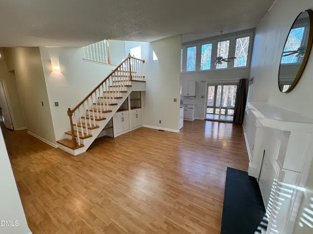 a view of entryway with stairs and wooden floor
