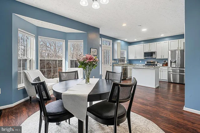 a view of a livingroom with furniture window and wooden floor