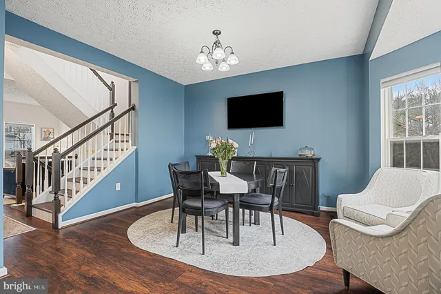 a kitchen with stainless steel appliances a refrigerator stove and microwave