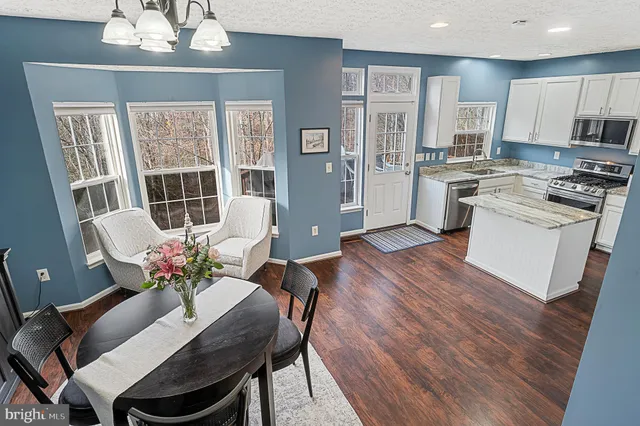 a view of a workspace with furniture