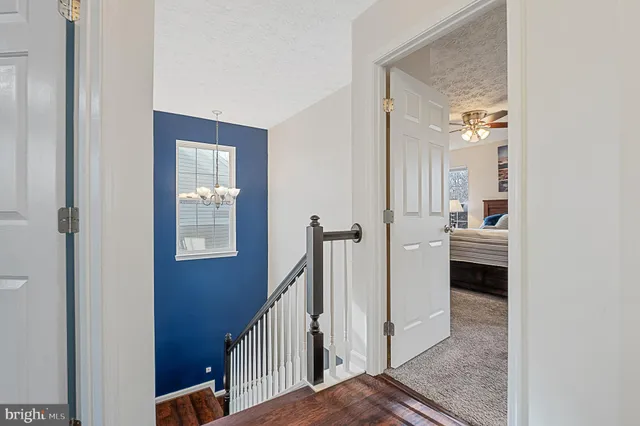a living room with fireplace furniture and a book shelf