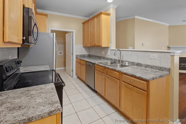 a kitchen with sink and cabinets