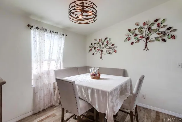 a view of a dining area with furniture and wooden floor