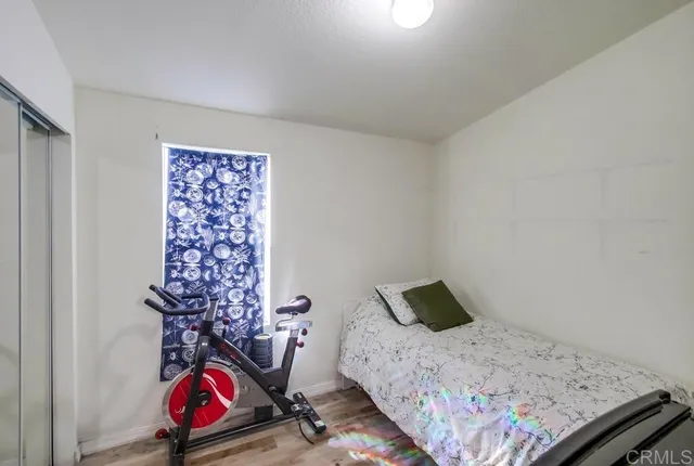 a bedroom with a bed and dresser