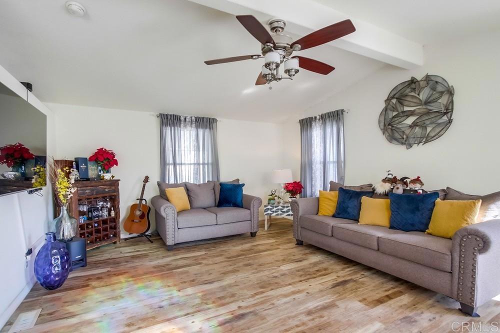 9902 Jamacha Boulevard, Unit SPC 7 Spring Valley, CA 91977 - Photo 10 of 33 a living room with furniture and a wooden floor