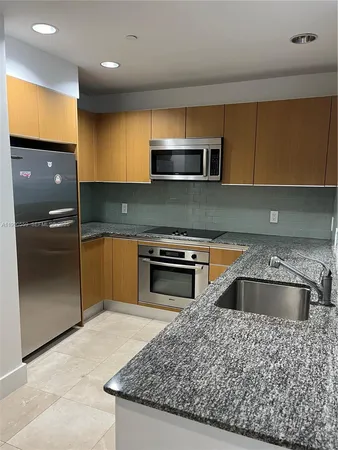 a kitchen with a stove and a sink