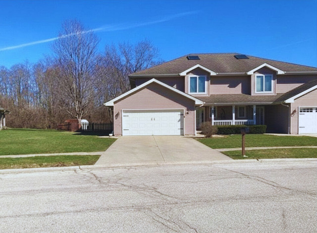 a view of house with outdoor space and street view