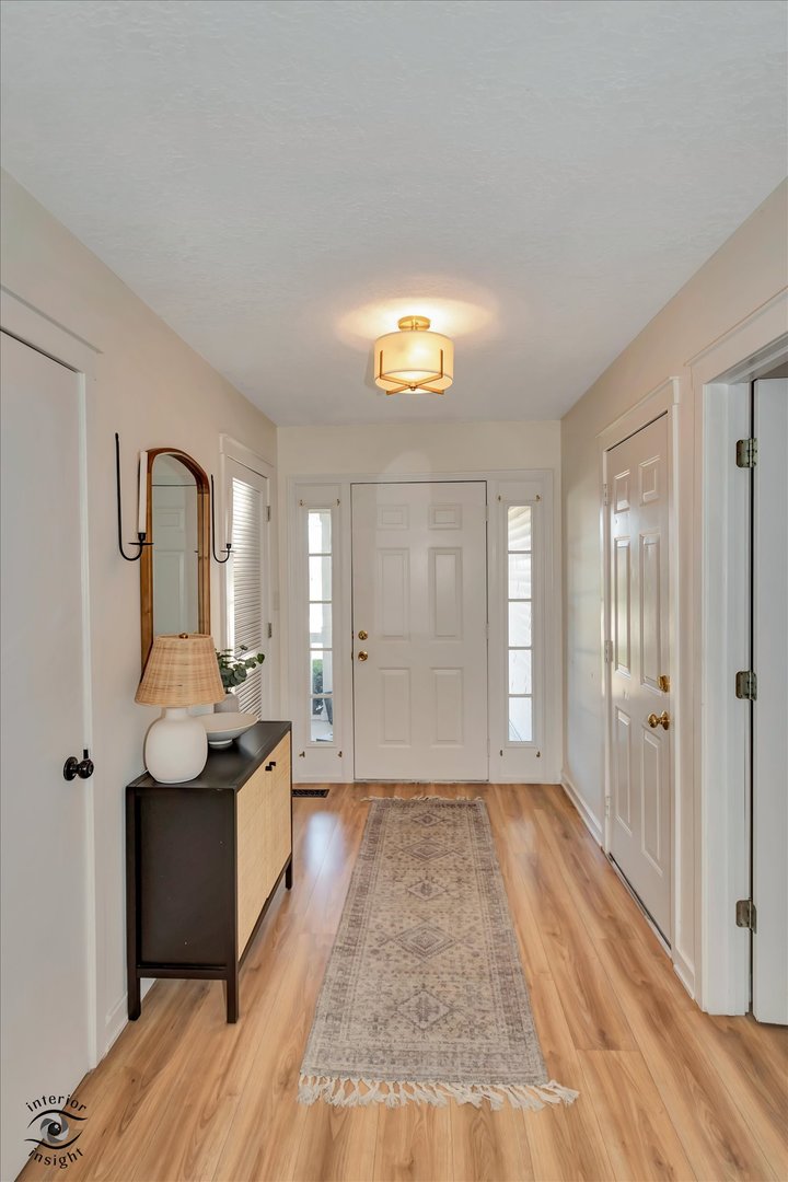 426 South Walnut Street Manteno, IL 60950 - Photo 2 of 26 a view of a room with wooden floor and furniture