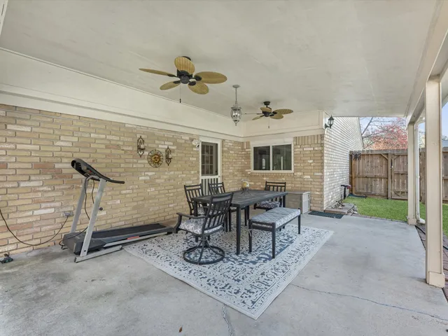 a view of a livingroom with furniture and a window