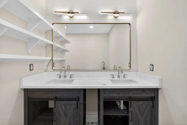 a view with a sink and cabinets