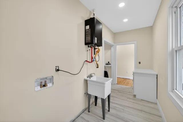 a view of a hallway with seating area