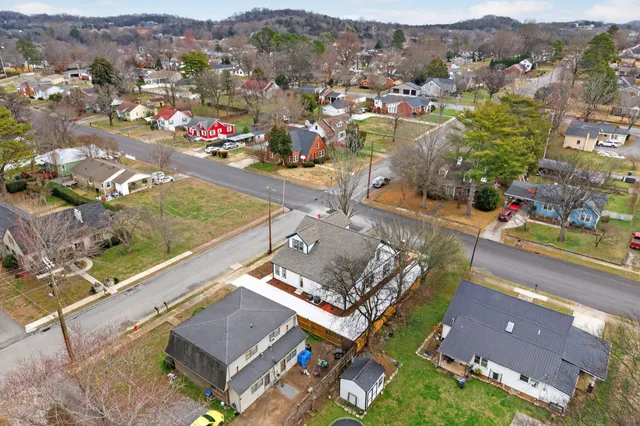 an aerial view of a house with a swimming pool