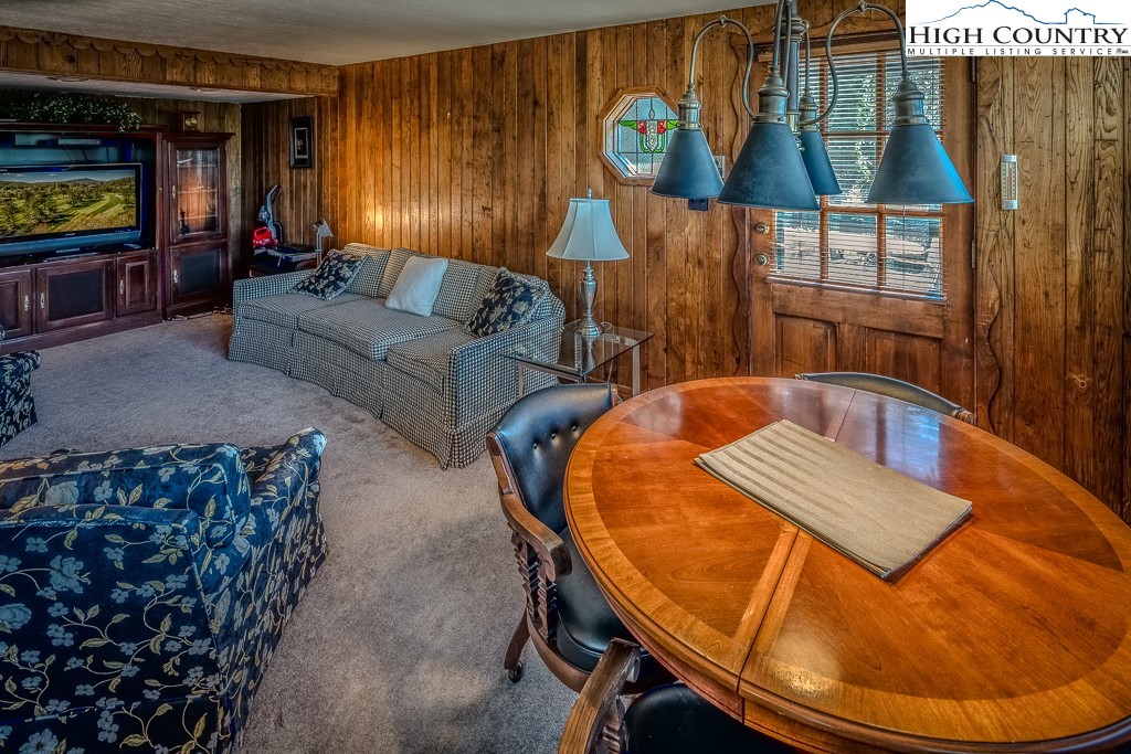 122 Hornbeam Road Boone, NC 28607 - Photo 15 of 28 a living room with furniture and a flat screen tv