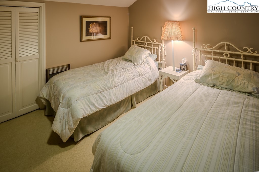 122 Hornbeam Road Boone, NC 28607 - Photo 23 of 28 a bed room with two bed and a night stand