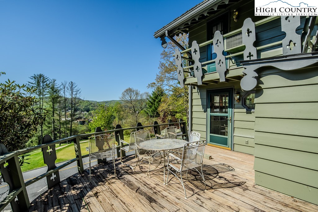 122 Hornbeam Road Boone, NC 28607 - Photo 6 of 28 a view of a chairs and table on the deck