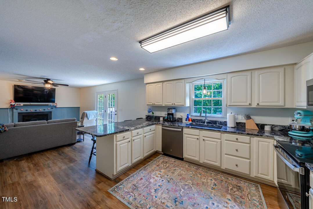 6806 Calais Drive Durham, NC 27712 - Photo 15 of 31 a kitchen with lots of counter top space and appliances