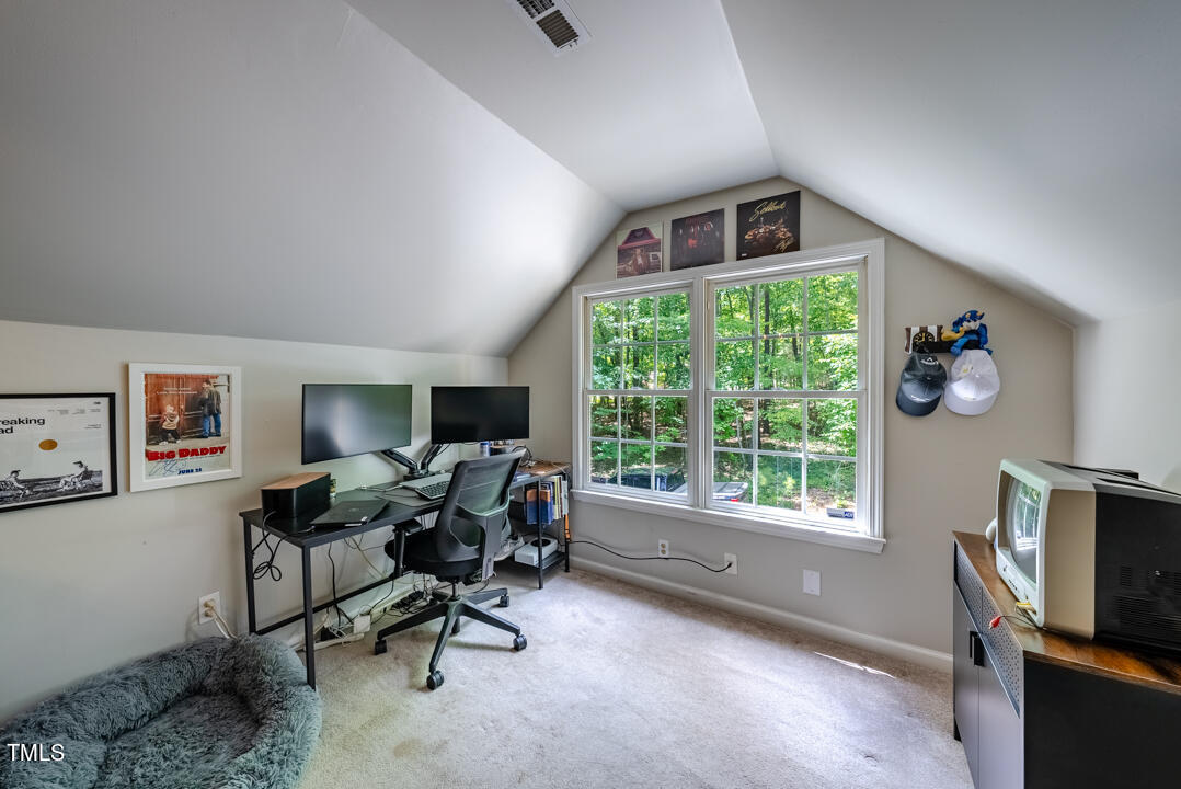 6806 Calais Drive Durham, NC 27712 - Photo 17 of 31 a view of a workspace with furniture and a window