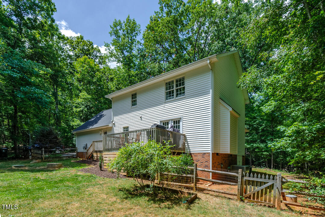 6806 Calais Drive Durham, NC 27712 - Photo 25 of 31 a front view of a house with a yard