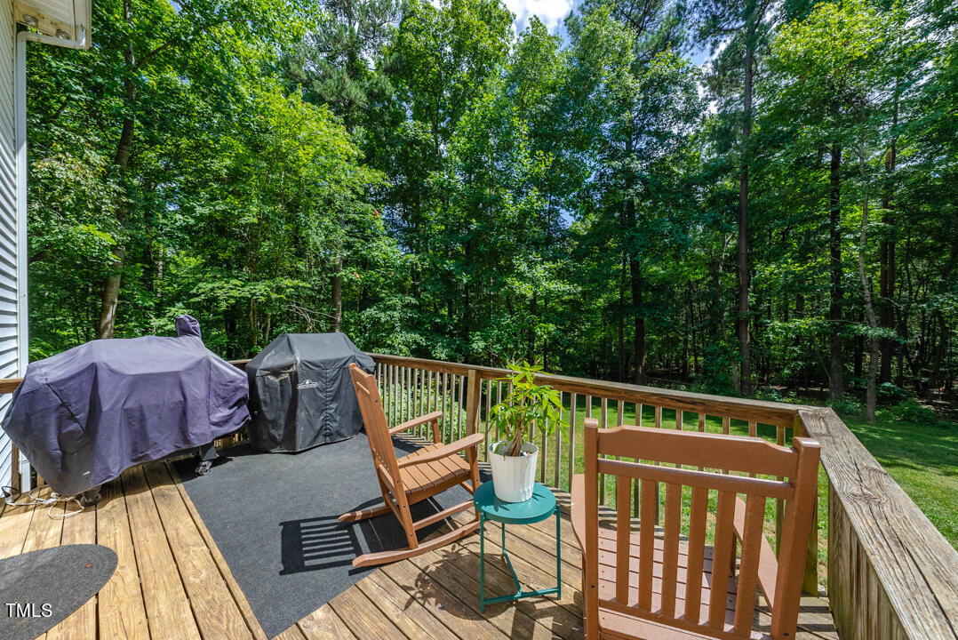 6806 Calais Drive Durham, NC 27712 - Photo 27 of 31 a view of deck with furniture and trees