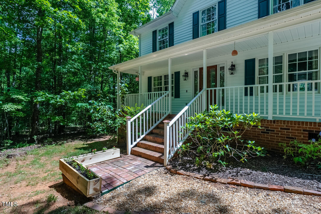 6806 Calais Drive Durham, NC 27712 - Photo 31 of 31 a view of a couches in the patio with wooden fence