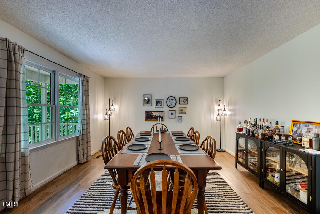 6806 Calais Drive Durham, NC 27712 - Photo 8 of 31 a view of a dining room with furniture window and outside view