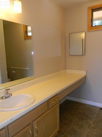 692 Gilcrest Road Colorado Springs, CO 80906 - Photo 13 of 25 Large master bath vanity with lots of counter space.
