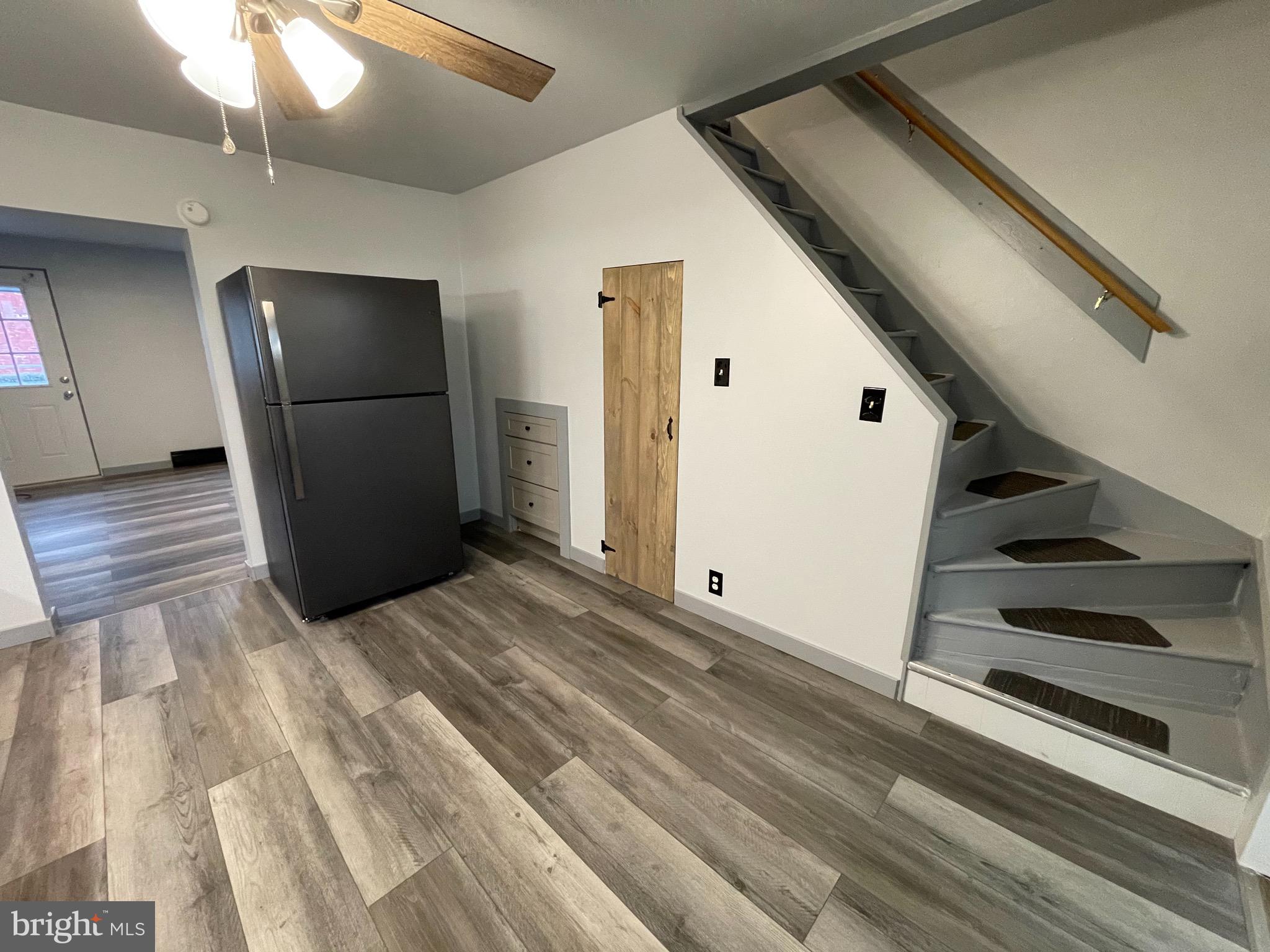 105 Spring Garden Street Leesport, PA 19533 - Photo 3 of 16 an empty room with wooden floor and entryway