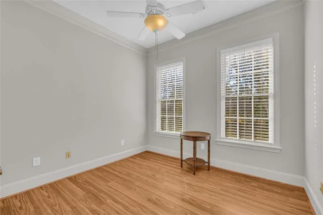 a view of a room with wooden floor and bathroom