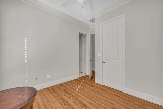 a bathroom with a granite countertop sink a toilet and a mirror