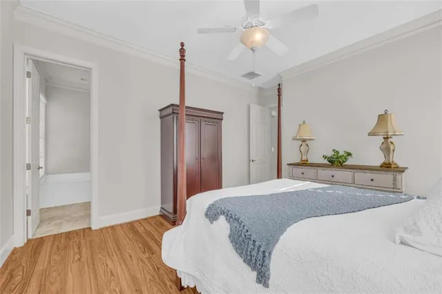a bathroom with a tub a sink and mirror