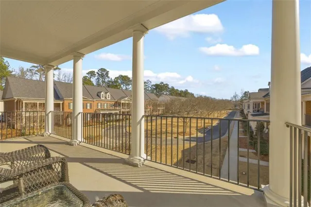 a sign that is sitting in front of a tree