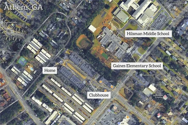 a view of a house with cars park