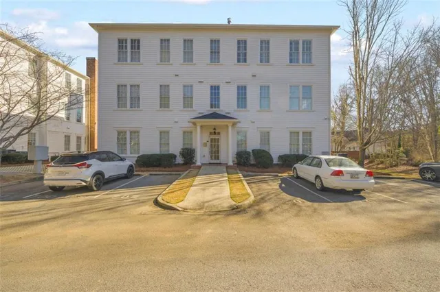 a view of a swimming pool with outdoor seating
