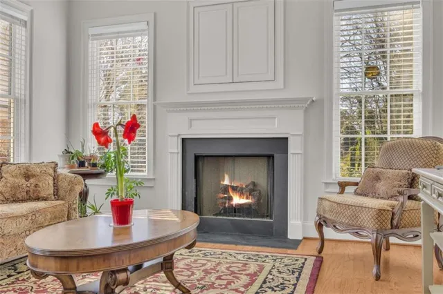 a living room with furniture and a fireplace
