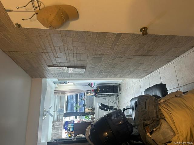 104-29 Roosevelt Avenue Queens, NY 11368 - Photo 11 of 23 a living room with furniture and a window