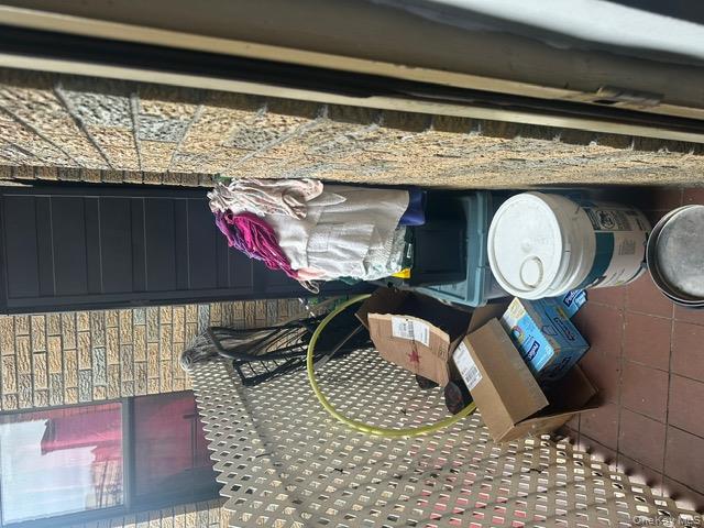 104-29 Roosevelt Avenue Queens, NY 11368 - Photo 13 of 23 a bathroom with a toilet and a shower curtain