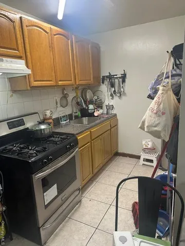 a kitchen with stainless steel appliances granite countertop a stove and a sink