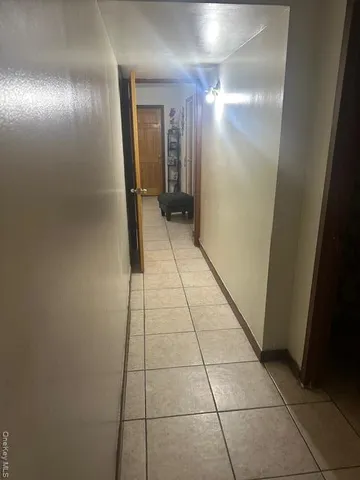 a view of hallway with a mirror